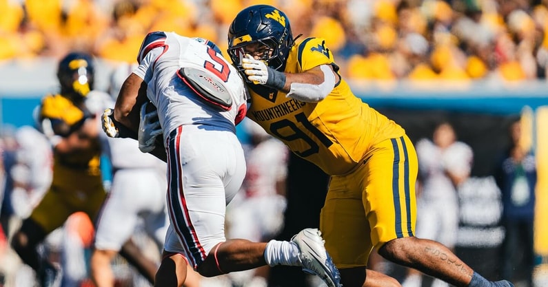 West Virginia defensive linman Devin Grant makes the tackle against Robert Morris