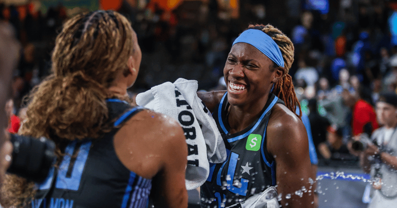 Sep 8, 2025; College Park, Georgia, USA; Atlanta Dream forward Naz Hillmon (0) and guard Rhyne Howard (10) laugh together after the victory against the Connecticut Sun at Gateway Center Arena at College Park. Mandatory Credit: Jordan Godfree-Imagn Images