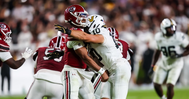 South Carolina Gamecocks quarterback LaNorris Sellers (16) is hit by Vanderbilt Commodores linebacker Langston Patterson (10) as he passes. Sellers was injured on the play and Patterson was ejected for targeting in the second quarter at Williams-Brice Stadium. Mandatory Credit: Jeff Blake-Imagn Images