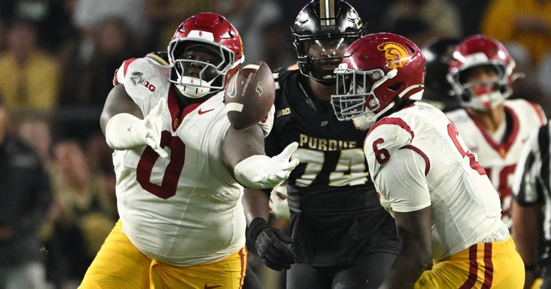 USC Trojans defensive tackle Jamaal Jarrett (0) makes an interception during the second half against the Purdue Boilermakers at Ross-Ade Stadium