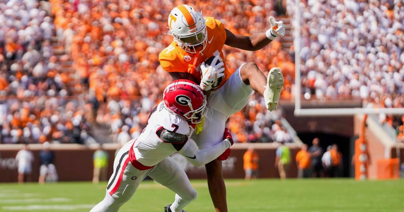 Angelina Alcantar/News Sentinel / USA TODAY NETWORK via Imagn Images | Georgia defensive back Daniel Harris (7) tackles Tennessee wide receiver Braylon Staley (14) as Staley catches the ball before a NCAA football game between Tennessee and Georgia at Neyland Stadium in Knoxville, Tennessee, on September 13, 2025.