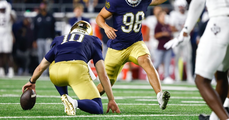 Notre Dame holder Tyler Buchner drops snap Texas A&M