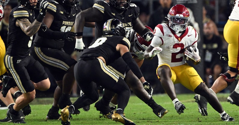 USC Trojans running back Waymond Jordan (2) runs the ball toward Purdue Boilermakers defensive back Tony Grimes (0) during the second half at Ross-Ade Stadium