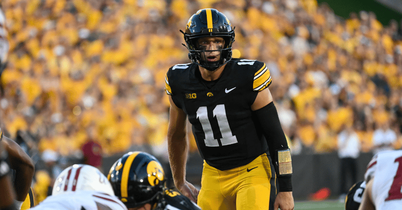 Mark Gronowski threw for three touchdowns in the Hawkeyes win over UMass. (Photo by Dennis Scheidt)