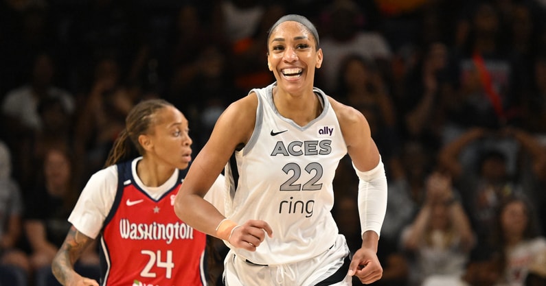 Las Vegas Aces center A'ja Wilson (22) is all smiles after a basket against the Washington Mystics during the fourth quarter at CareFirst Arena. Mandatory Credit: Rafael Suanes-Imagn Images