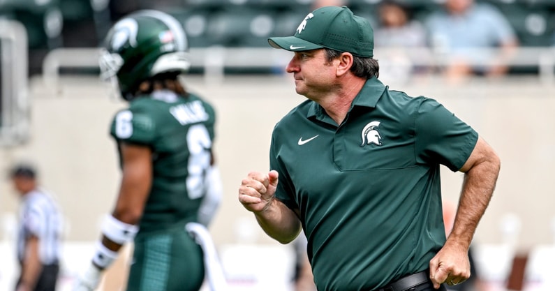 Michigan State's head coach Jonathan Smith jogs back to the sideline before the game against Youngstown State on Saturday, Sept. 13, 2025, at Spartan Stadium in East Lansing. - Nick King, USA TODAY Sports