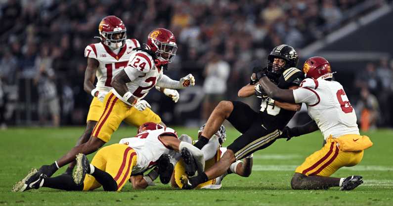 Purdue Boilermakers running back Devin Mockobee (45) is tackled by multiple USC Trojans during the second quarter at Ross-Ade Stadium