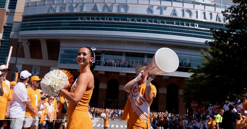 Saul Young/News Sentinel / USA TODAY NETWORK via Imagn Images | University of Tennessee cheerleaders warms up the crowd ahead of the Vole Walk for NCAA college football game between Tennessee and Georgie on September 13, 2025, Knoxville, Tennessee.