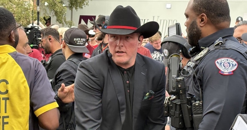 ESPN's Pat McAfee arrives on the set of College GameDay in Norman on Saturday.