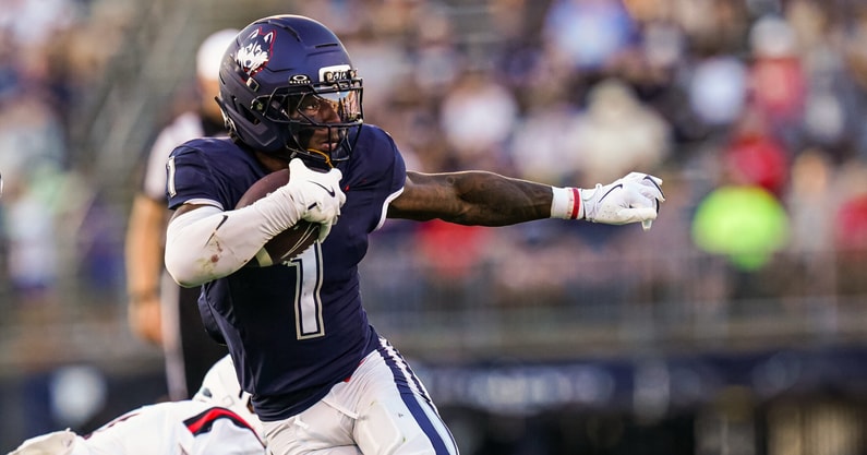 UConn Football RB Cam Edwards (1) runs away from a Ball State defender