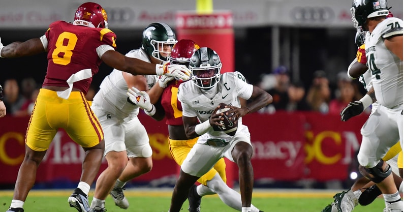 Michigan State Spartans quarterback Aidan Chiles (2) runs the ball against the Southern California Trojans during the first half at the Los Angeles Memorial Coliseum. - Gary A. Vasquez, USA TODAY Sports