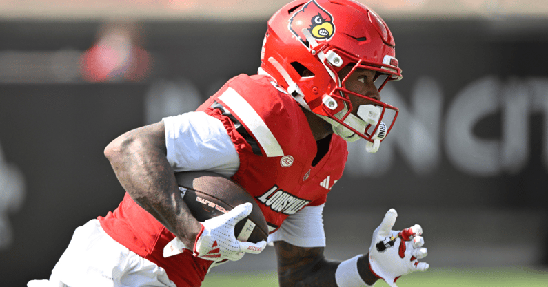 Sep 20, 2025; Louisville, Kentucky, USA; Louisville Cardinals wide receiver Caullin Lacy (5) returns a kickoff against the Bowling Green Falcons during the first quarter at L&N Federal Credit Union Stadium. Mandatory Credit: Jamie Rhodes-Imagn Images