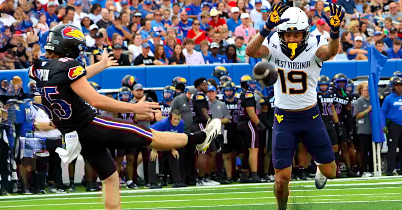 West Virginia's Nick Taylor attempt to block the punt