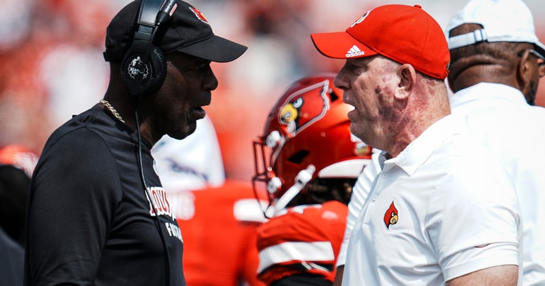 Louisville football head coach Jeff Brohm, right, talks with defense coordinator Ron English as the Cards take on Bowling Green in football Saturday, Sept. 20, 2025, in Louisville, Kentucky