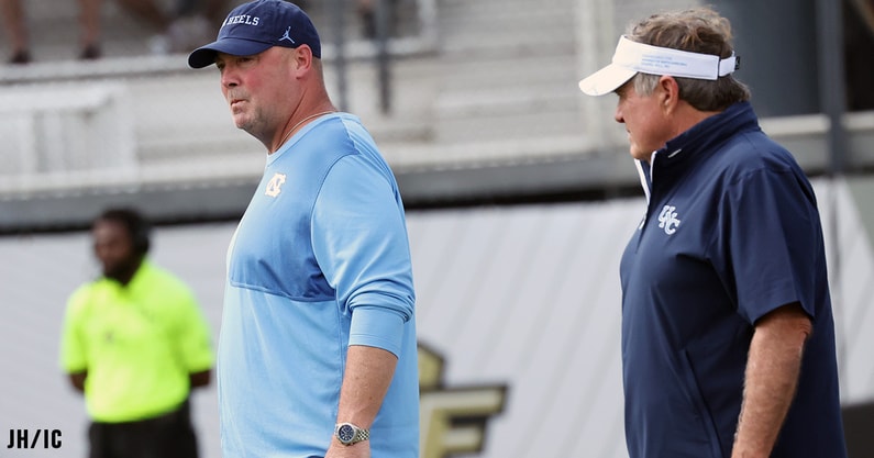 UNC coach Bill Belichick and offensive coordinator Freddie Kitchens in the pregame before the loss at UCF.