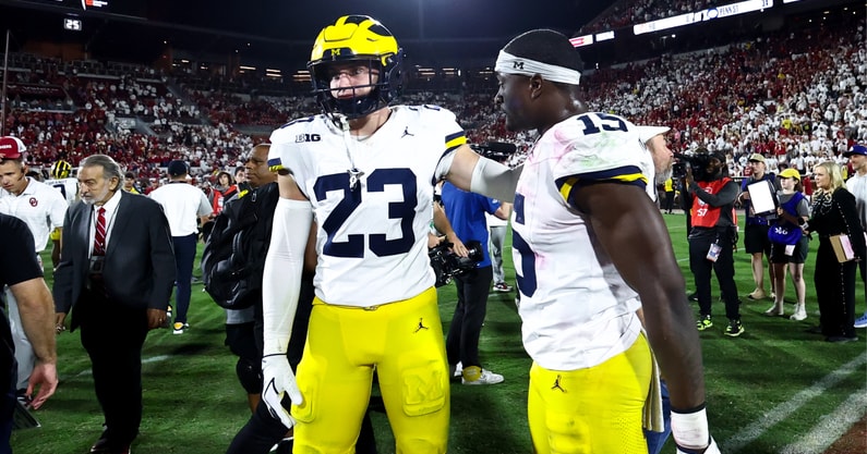 Sep 6, 2025; Norman, Oklahoma, USA; Michigan Wolverines linebacker Ernest Hausmann (15) and linebacker Cole Sullivan (23) resct after the game against the Oklahoma Sooners at Gaylord Family-Oklahoma Memorial Stadium. Mandatory Credit: Kevin Jairaj-Imagn Images