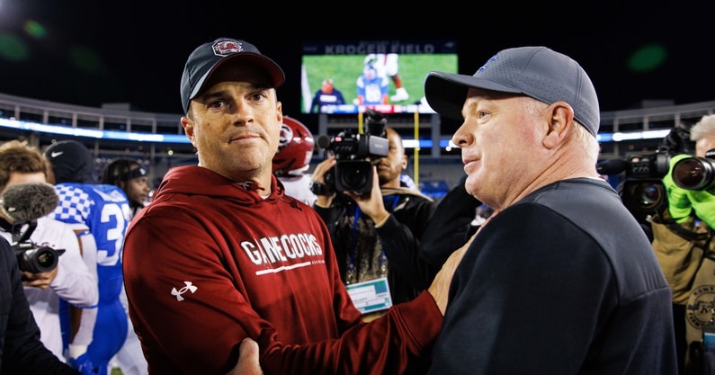 Oct 8, 2022; Lexington, Kentucky, USA; South Carolina Gamecocks head coach Shane Beamer and Kentucky Wildcats head coach Mark Stoops shake hands after a game at Kroger Field. Mandatory Credit: Jordan Prather-Imagn Images