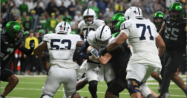 Dec 7, 2024; Indianapolis, IN, USA; Penn State Nittany Lions quarterback Drew Allar (15) dives for a touchdown during the second quarter against the Oregon Ducks in the 2024 Big Ten Championship game at Lucas Oil Stadium. Mandatory Credit: Robert Goddin-Imagn Images