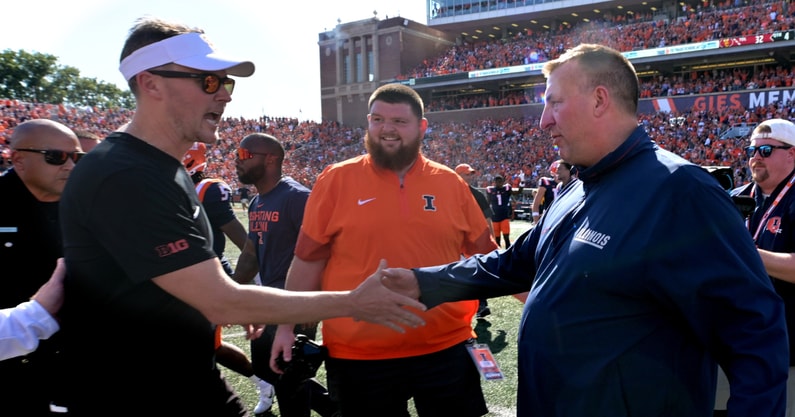 Illinois Fighting Illini head coach Bret Bielema, and USC Trojans head coach Lincoln Riley shake hands after the 34-32 Illini win at Memorial Stadium