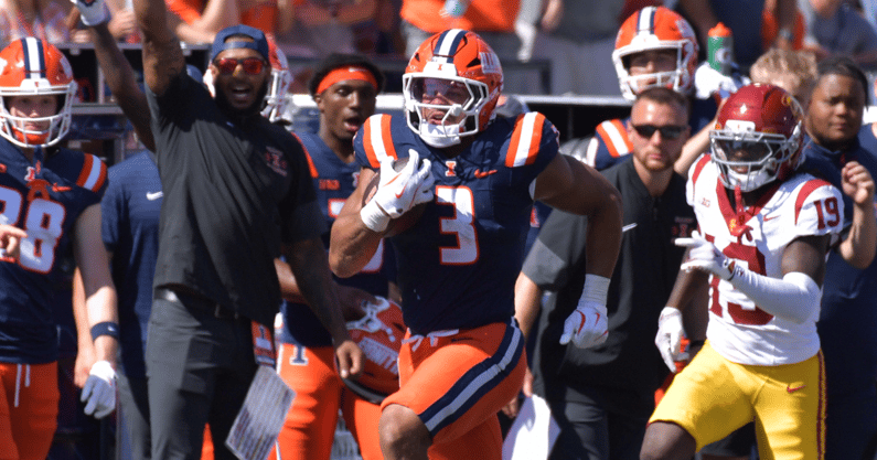 Illinois Fighting Illini running back Kaden Feagin (3) runs for a touchdown as USC Trojans linebacker Anthony Beavers Jr. (15) pursues during the second half at Memorial Stadium