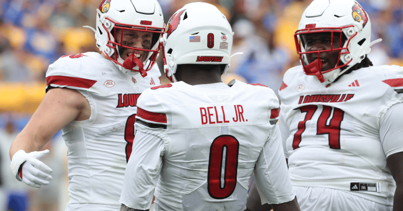 Sep 27, 2025; Pittsburgh, Pennsylvania, USA; Louisville Cardinals wide receiver Chris Bell (0) celebrates his touchdown with tight end Nate Kurisky (85) and offensive lineman Jordan Church (74) against the Pittsburgh Panthers during the second quarter at Acrisure Stadium. Mandatory Credit: Charles LeClaire-Imagn Images