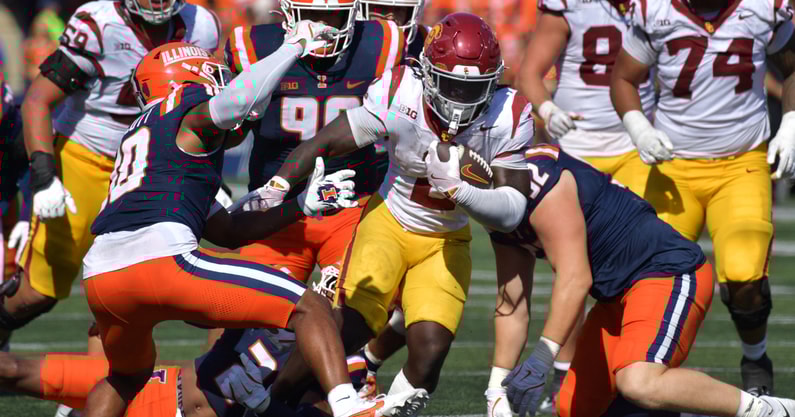 USC Trojans running back Waymond Jordan (2) runs through the Illinois Fighting Illini defensive line during the second half at Memorial Stadium