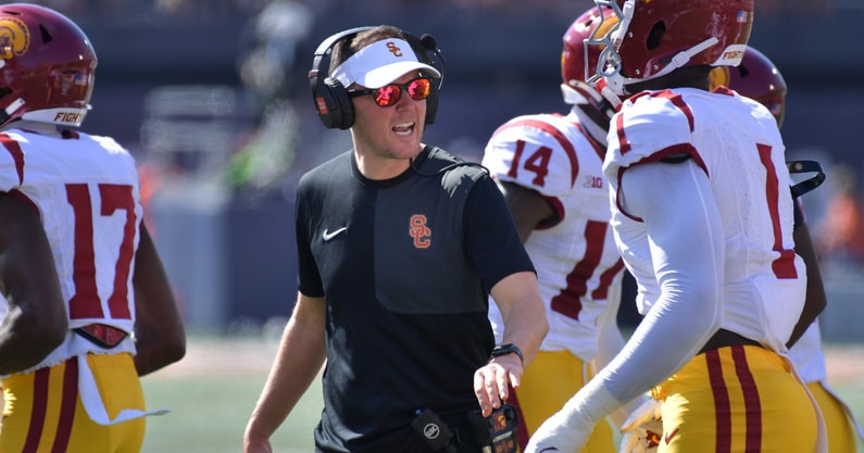 USC Trojans head coach Lincoln Riley talks with players during the first half against the Illinois Fighting Illini at Memorial Stadium