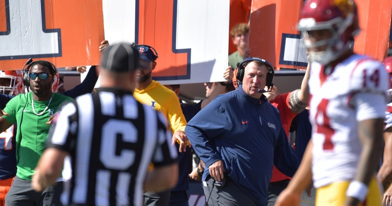 Illinois Fighting Illini head coach Bret Bielema looks on as USC Trojans quarterback Jayden Maiava (14) talks with an official during the first half at Memorial Stadium