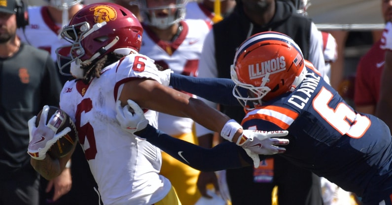 Illinois Fighting Illini defensive back Jaheim Clarke (6) pursues USC Trojans wide receiver Makai Lemon (6) during the second half at Memorial Stadium