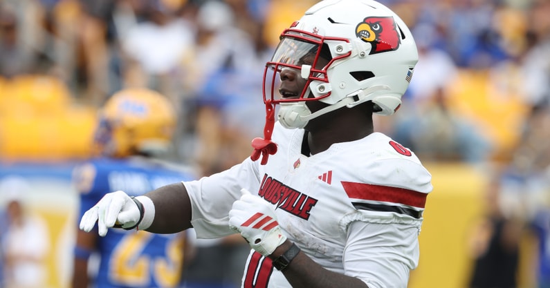 Sep 27, 2025; Pittsburgh, Pennsylvania, USA; Louisville Cardinals wide receiver Chris Bell (0) celebrates his touchdown against the Pittsburgh Panthers during the second quarter at Acrisure Stadium. Mandatory Credit: Charles LeClaire-Imagn Images