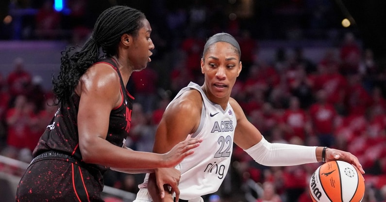 Indiana Fever forward Aliyah Boston (7) defends Las Vegas Aces center A'ja Wilson (22) during Game 4 of the WNBA semifinals on Sunday, Sept. 28, 2025, at Gainbridge Fieldhouse in Indianapolis.