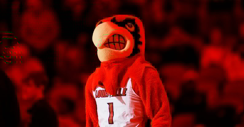 Louisville Cardinals mascot is bathed in red as the team takes on Bucknell during an exhibition game at the KFC Yum! Center in Louisville, Kentucky Tuesday October 28, 2028.