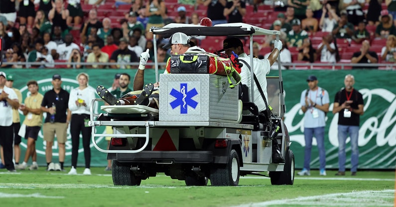 USF RB Cartevious Norton carted off with an injury vs. Charlotte
