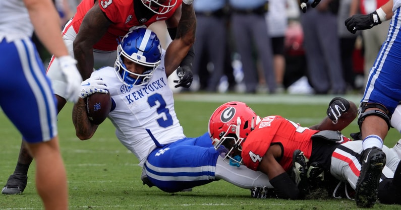 Kentucky RB Seth McGowan is gobbled up by the Georgia defense, via Dale Zanine, Imagn Images