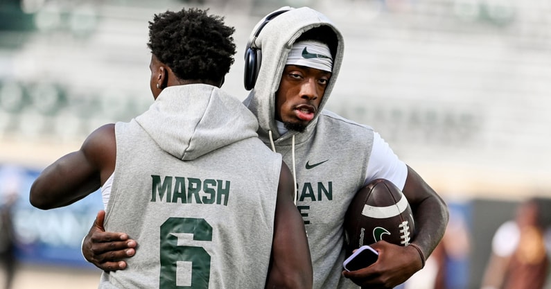 Michigan State's quarterback Aidan Chiles, right, hugs Nick Marsh before the football game against Western Michigan on Friday, Aug. 29, 2025, in East Lansing. - Nick King, USA TODAY Sports