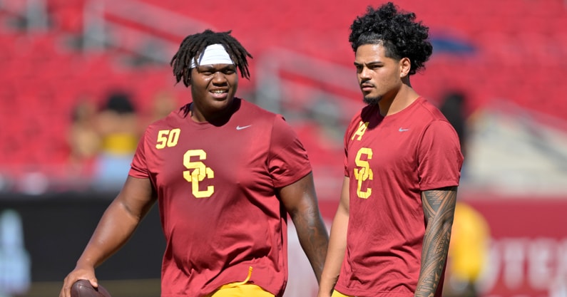 USC Trojans offensive lineman J'Onre Reed (50) quarterback Jayden Maiava (14) warm up prior to the game against the Georgia Southern Eagles at United Airlines Field at Los Angeles Memorial Coliseum