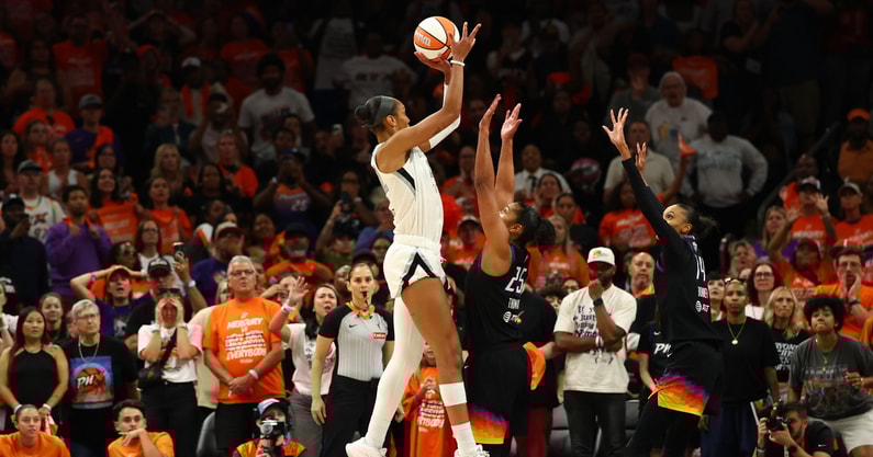 Las Vegas Aces center A'ja Wilson (22) makes a makes the game winning shot against Phoenix Mercury forward Alyssa Thomas (25) in the second half during game three of the 2025 WNBA Finals at PHX Arena. Mandatory Credit: Mark J. Rebilas-Imagn Images