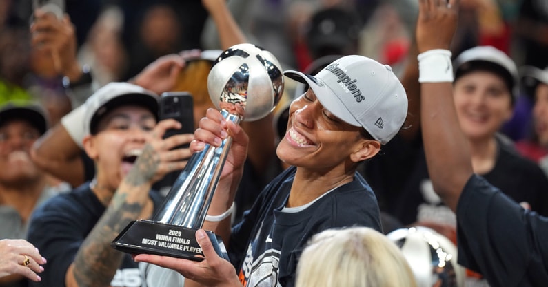 Las Vegas Aces center A'ja Wilson (22) pressures Phoenix Mercury forward Alyssa Thomas (25) in Game Four of the WNBA Finals at Mortgage Matchup Center on Oct. 10, 2025, in Phoenix.