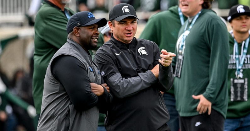 Michigan State's head coach Jonathan Smith, right, talks with UCLA's interim head coach Tim Skipper before the football game on Saturday, Oct. 11, 2025, at Spartan Stadium in East Lansing. - Nick King, USA TODAY Sports