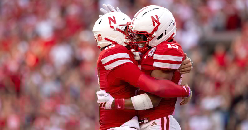 Nebraska football QB Dylan Raiola and WR Nyziah Hunter (right) celebrate Hunter's TD catch during the Huskers' 38-27 win over Michigan State