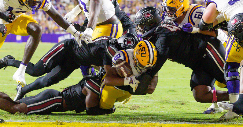 South Carolina Gamecocks defensive lineman Monkell Goodwine (44) forces a fumble at the 1 yard line by LSU Tigers running back Ju'Juan Johnson (8) during the first half at Tiger Stadium. Mandatory Credit: Stephen Lew-Imagn Images