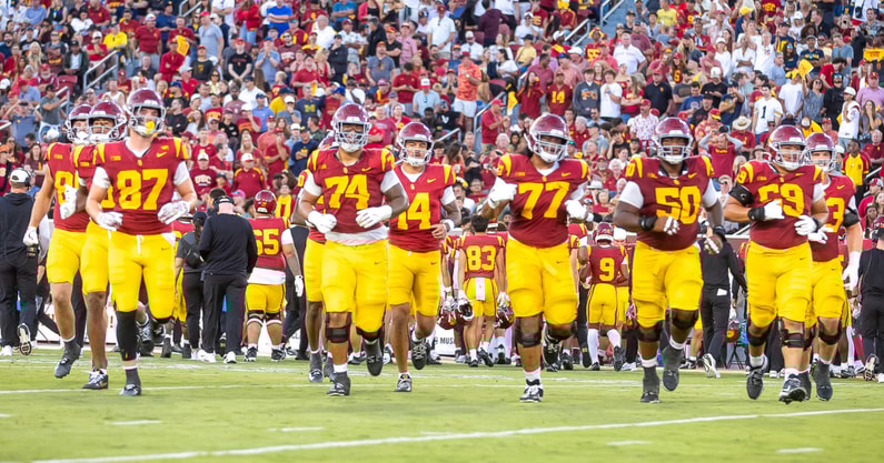 The USC Trojans take the field against Michigan
