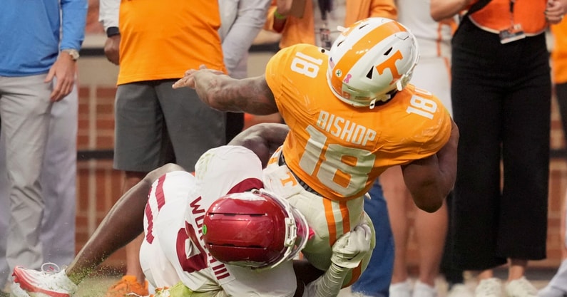 Saul Young/News Sentinel / USA TODAY NETWORK via Imagn Images | Arkansas defensive back Larry Worth III (3) brings down Tennessee running back DeSean Bishop (18) on a play that resulted in Bishop getting hurt in an NCAA college football game on Oct. 11, 2025, in Knoxville, Tennessee.
