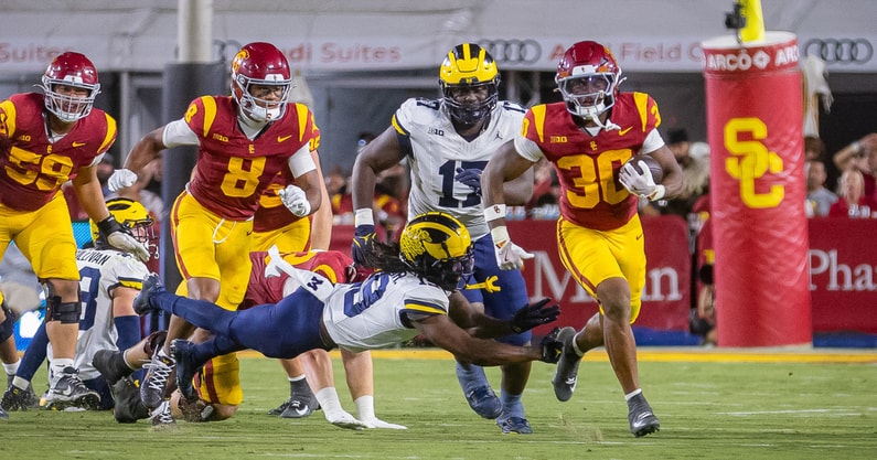 USC running back King Miller carries the ball during a game against the Michigan Wolverines