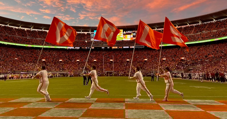 Saul Young/The Knoxville News-Sentinel Tennessee cheerleaders run across the end zone in celebration after Tennessee scored against Arkansas in an NCAA college football game on Oct. 11, 2025, in Knoxville, Tennessee.