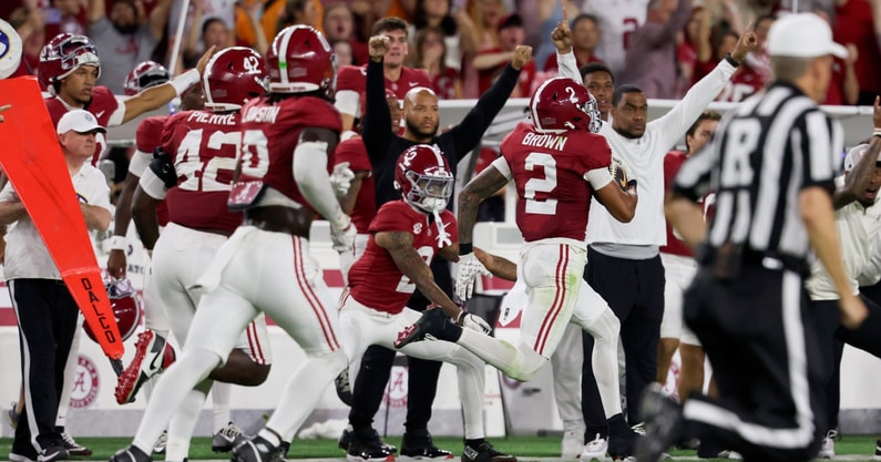 Oct 18, 2025; Tuscaloosa, Alabama, USA; Alabama Crimson Tide defensive back Zabien Brown (2) intercepts the ball for a touchdown in the second quarter against the Tennessee Volunteers at Saban Field at Bryant-Denny Stadium. Mandatory Credit: David Leong-Imagn Images