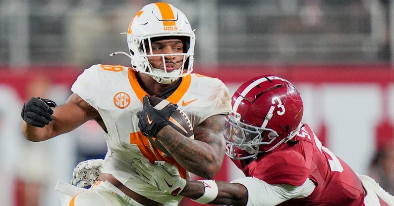 Brianna Paciorka/News Sentinel / USA TODAY NETWORK via Imagn Images | Tennessee running back DeSean Bishop (18) is grabbed by Alabama defensive back Keon Sabb (3) during a college football game at Bryant-Denny Stadium in Tuscaloosa, Ala., on Oct. 18, 2025.
