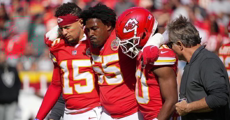 Oct 19, 2025; Kansas City, Missouri, USA; Kansas City Chiefs defensive tackle Omarr Norman-Lott (55) is helped off the field by quarterback Patrick Mahomes (15) and and cornerback Nohl Williams (20) after an injury against the Las Vegas Raiders during the third quarter of the game at GEHA Field at Arrowhead Stadium. Mandatory Credit: Denny Medley-Imagn Images