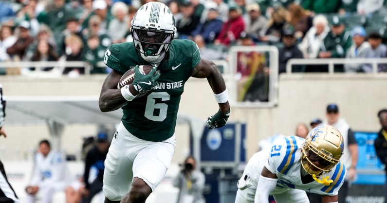 Michigan State wide receiver Nick Marsh (6) runs after catching the ball in the fourth quarter against the UCLA Bruins at Spartan Stadium. - Brendan Mullin, USA TODAY Sports