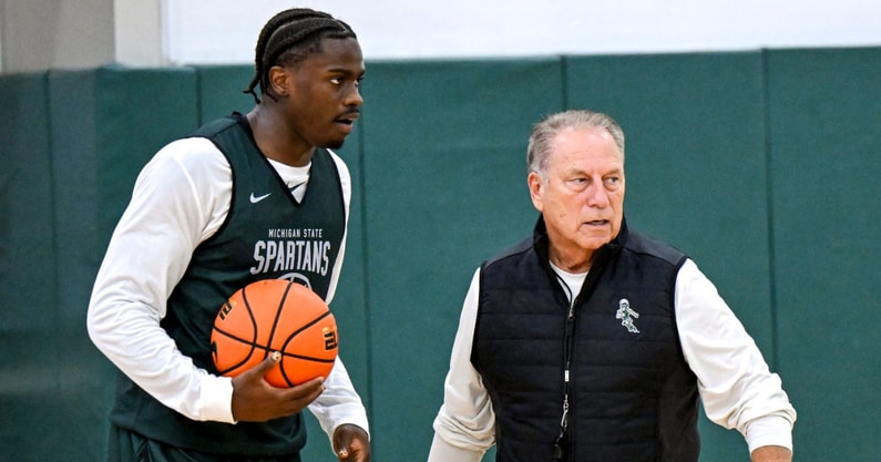 Michigan State's coach Tom Izzo, left, talks with Coen Carr, left, and Denham Wojcik during the first day of basketball practice on Monday, Sept. 22, 2025, at the Breslin Center in East Lansing. - Nick King, USA TODAY Sports